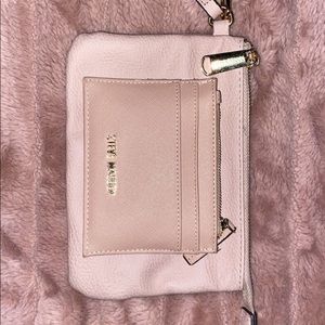 Matching baby pink Steve Madden wallet and makeup bag